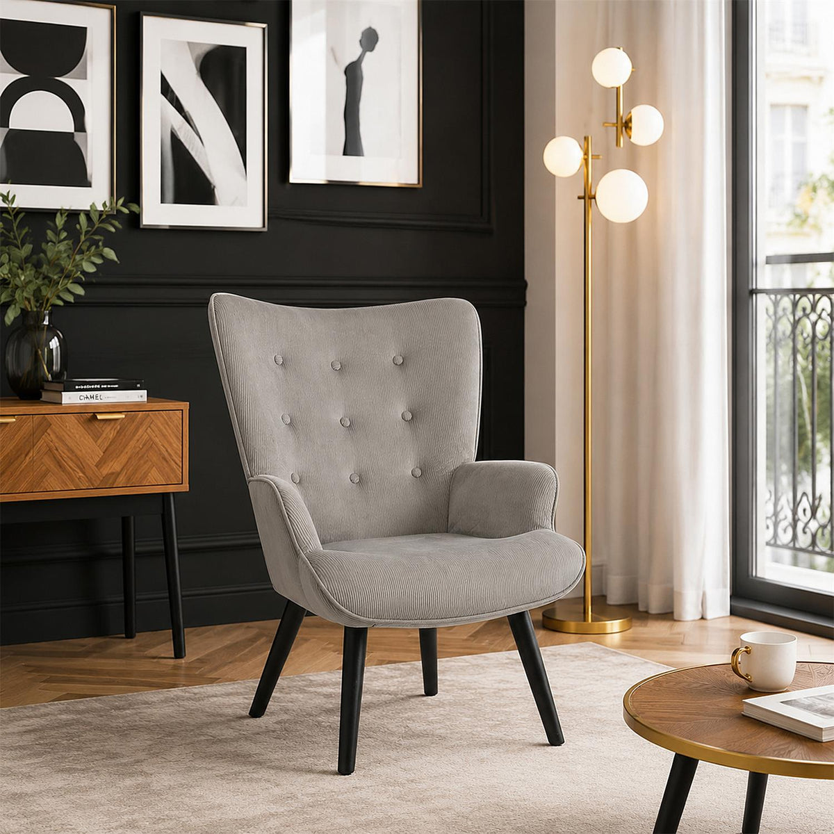 Fauteuil à oreilles capitonné en velours gris pieds noirs